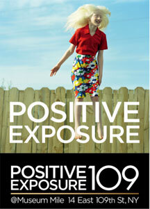 Image in poster style, showing a lady with blonde long hair, white skin, wearing a red short sleeves blouse and a flowery pencil skirt. She seems like jumping in the air. Behind her blu sky and a wooden fence. The writing says: Positive Exposure 109 at Museum Mile, 14 East 109th St NY.